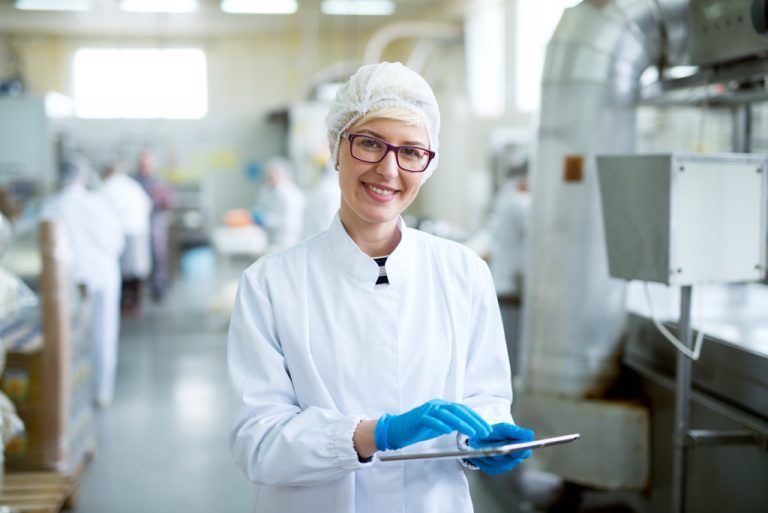 woman wearing PPE in the food manufacturing facility
