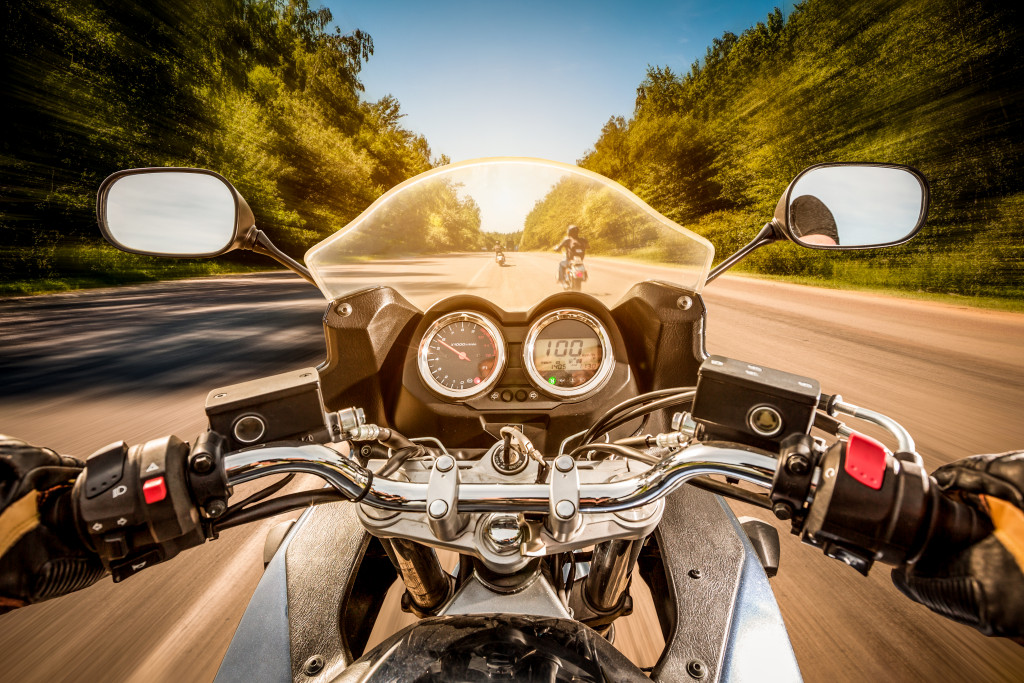 motorcycle rider point of view with blurred road and background